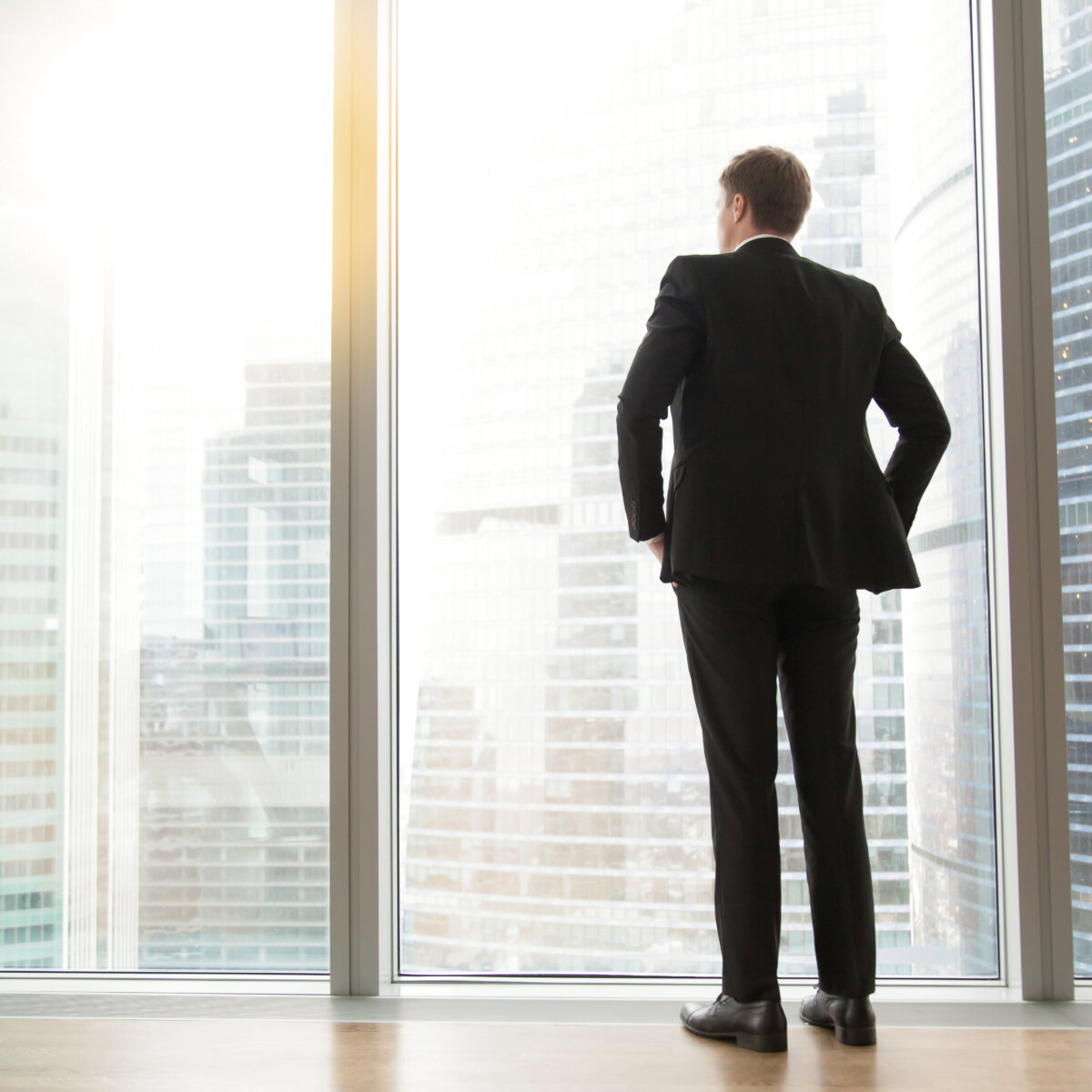 man standing in front of a window